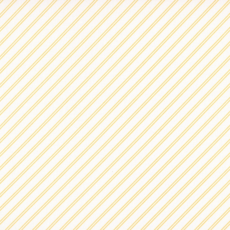 A white fabric with butter yellow stripes. 