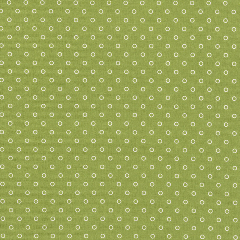 A grass green fabric with polka dots in a half drop pattern. 