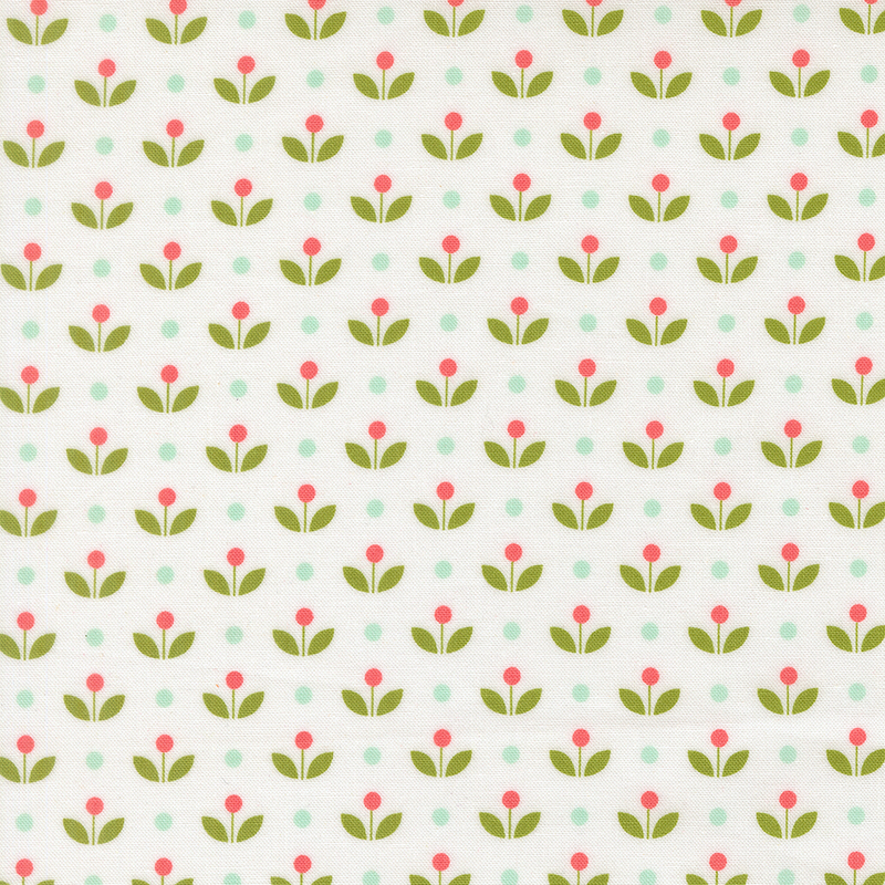 A white fabric with vintage inspired flowers with aqua polka dots. 