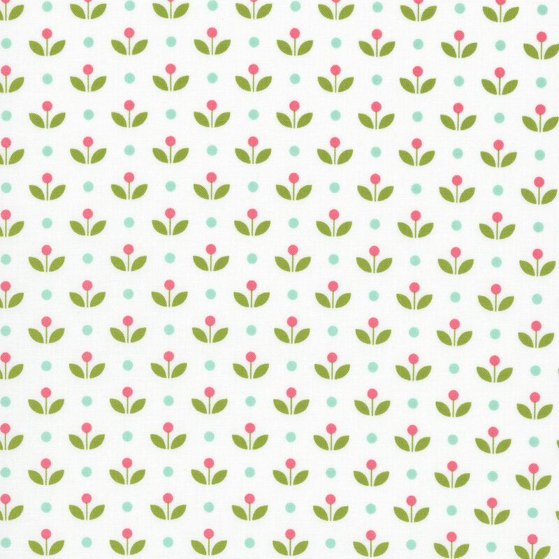 A white fabric with vintage inspired flowers with aqua polka dots. 