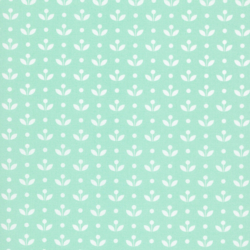 A aqua fabric with vintage inspired flowers with white polka dots. 