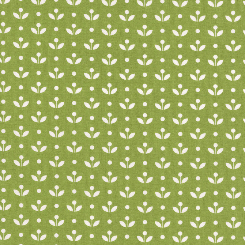 A grass green fabric with vintage inspired flowers with white polka dots. 