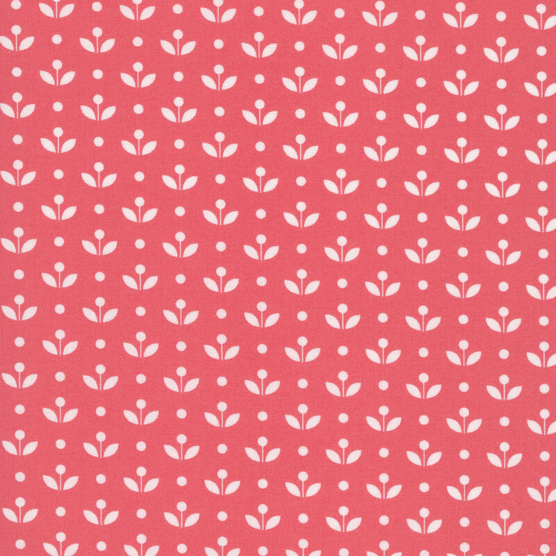 A watermelon red fabric with vintage inspired flowers with white polka dots. 