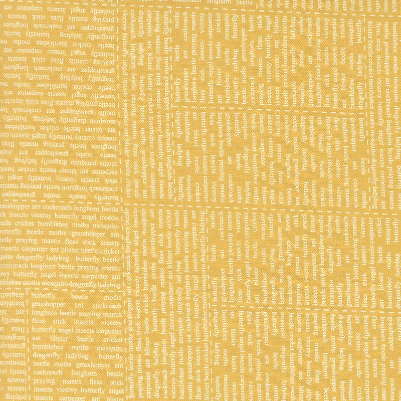 A golden fabric swatch with a news style text print.