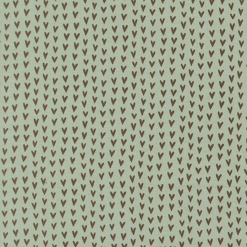 An aqua colored fabric swatch featuring rows of brown hearts.
