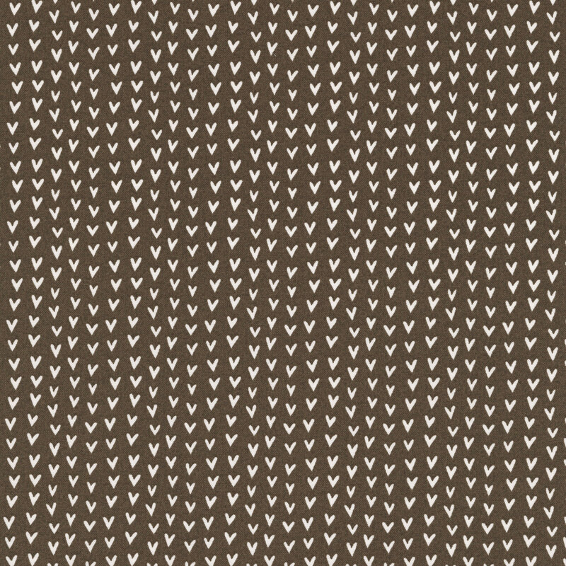 A brown fabric swatch featuring rows of off white hearts.