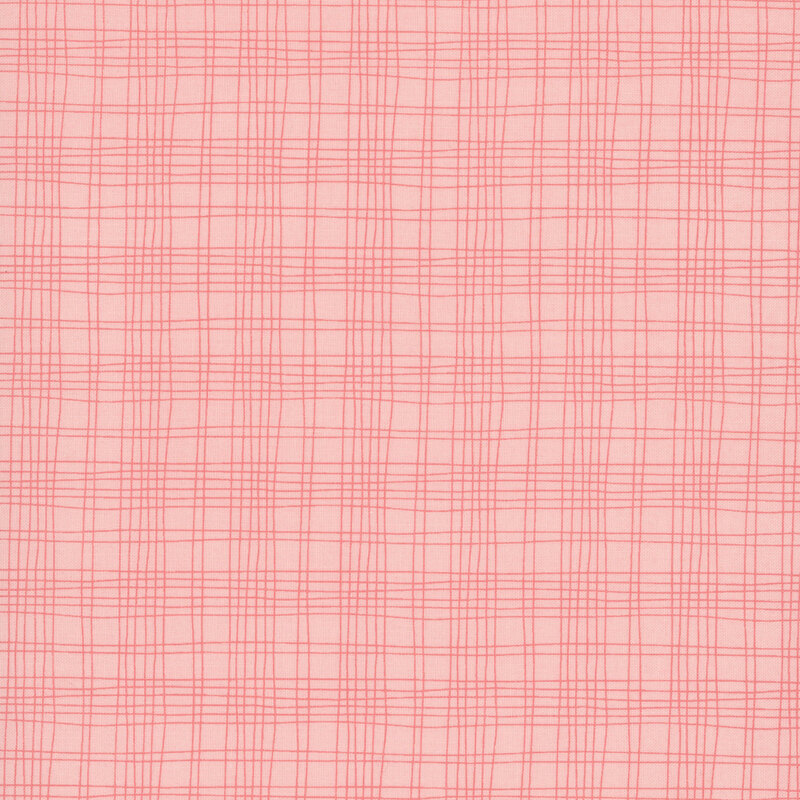 A blush pink fabric swatch featuring a free handed plaid pattern.