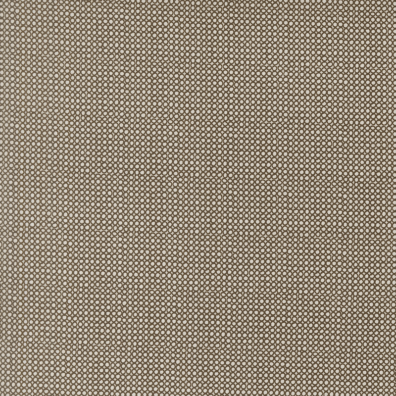 An open circle fabric swatch in brown hues.