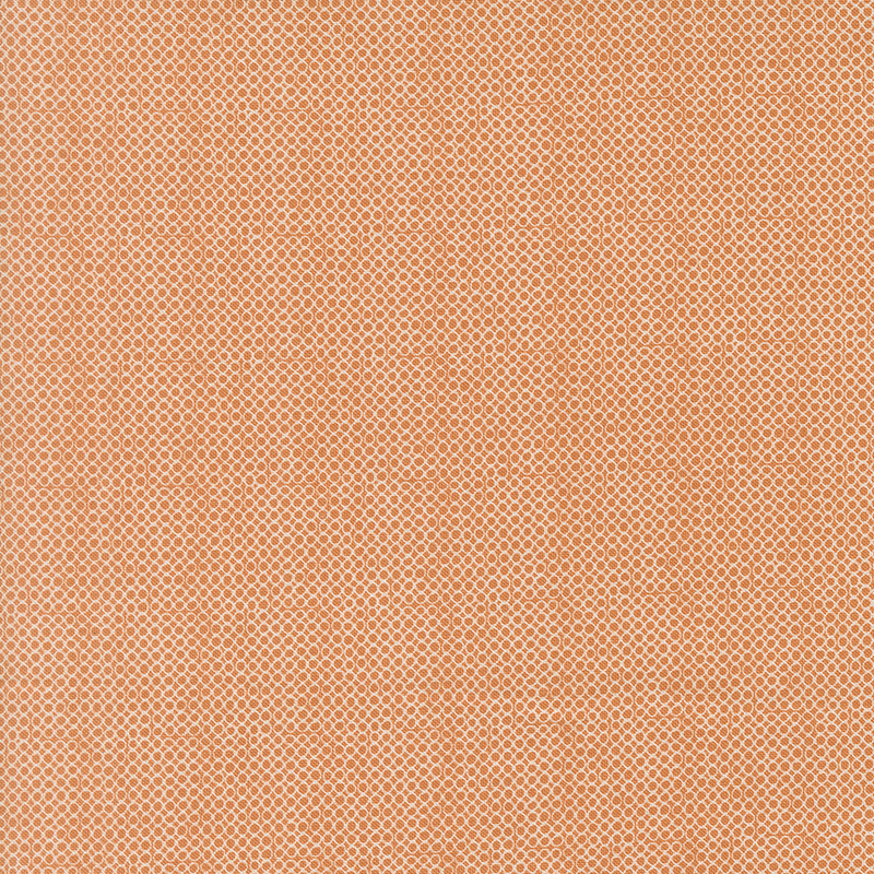 An open circle fabric swatch in orange.