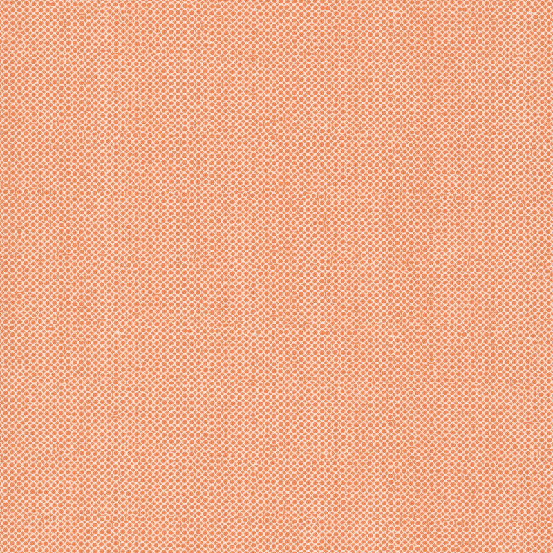 An open circle fabric swatch in orange.
