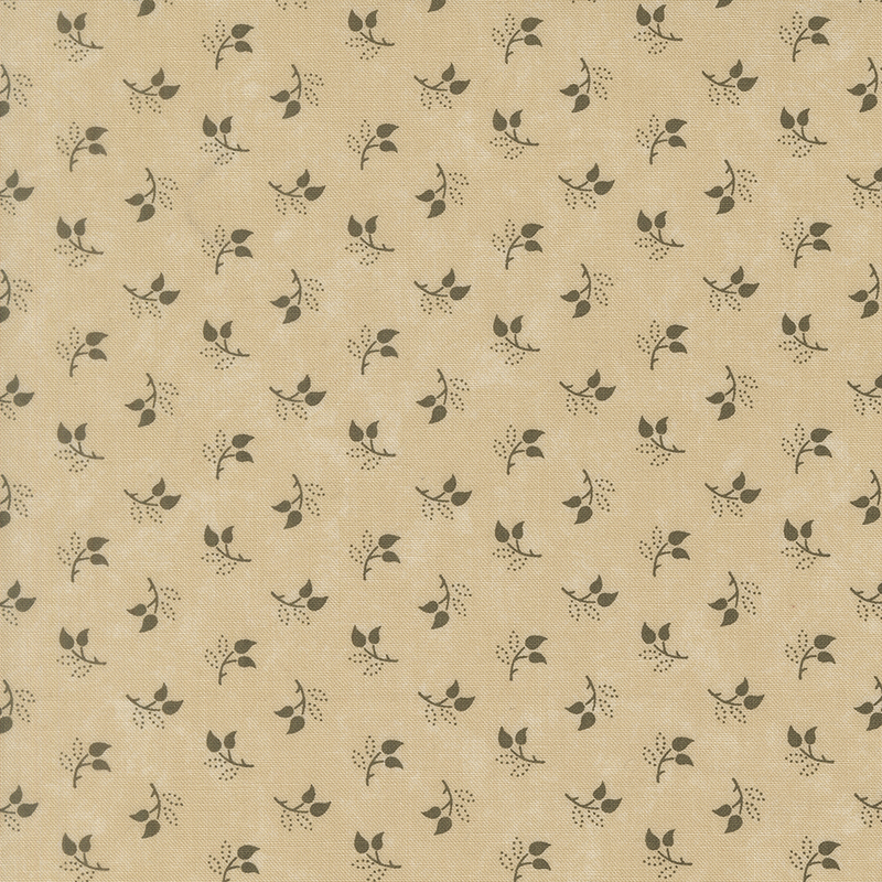 Mottled sand fabric featuring a tossed pattern of sprig leaves.
