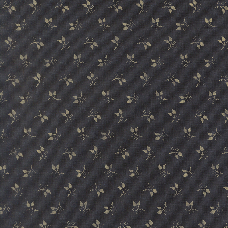 Mottled black fabric featuring a tossed pattern of sprig leaves.