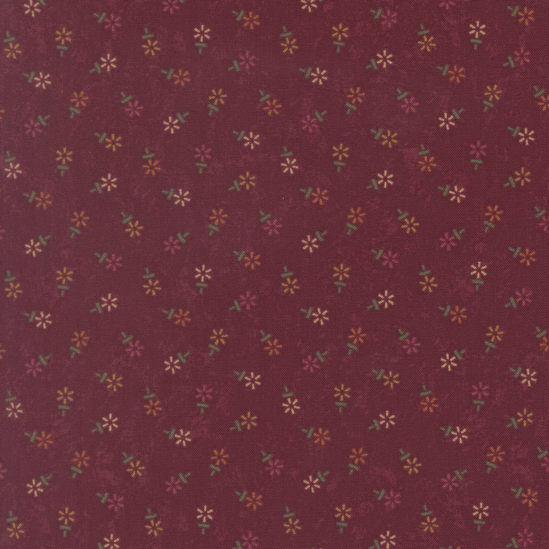 Mottled burgundy fabric featuring a tossed geometric floral print in hues of red, yellow, and cream.