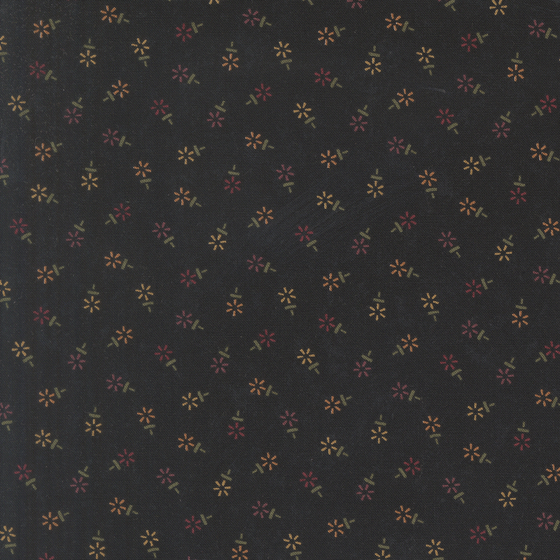 Mottled black fabric featuring a tossed geometric floral print in hues of red, yellow, and purple.