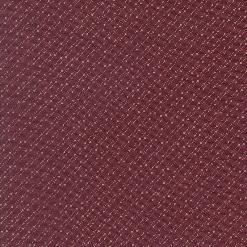 Mottled burgundy fabric featuring a stylized beaded-chain pattern in soft cream.