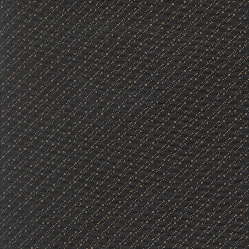 Mottled black fabric featuring a stylized beaded-chain pattern in soft cream.