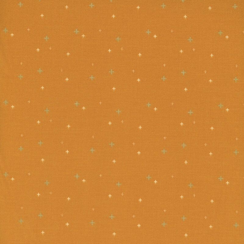 gold crosses scattered with yellow and cream crosses on orange fabric