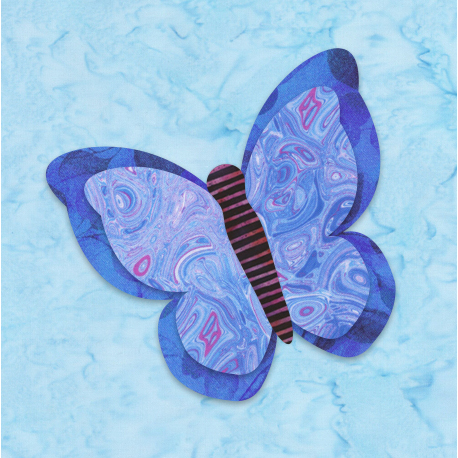 A decorative butterfly cutout in blue and purple patterns against a light blue background.