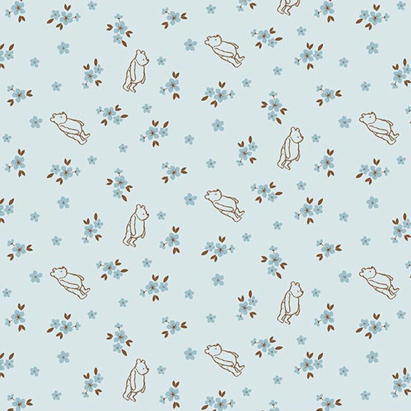 Blue fabric with a pattern of Winnie the Pooh scattered among small blue florals.