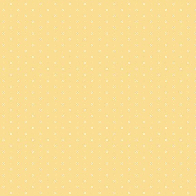 Light yellow fabric with a timeless pattern of X’s and dots, creating a simple yet versatile design.