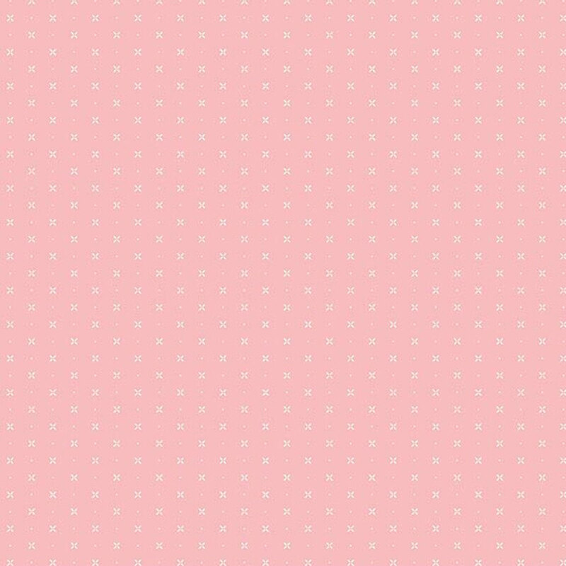 Light pink fabric with a timeless pattern of X’s and dots, creating a simple yet versatile design.