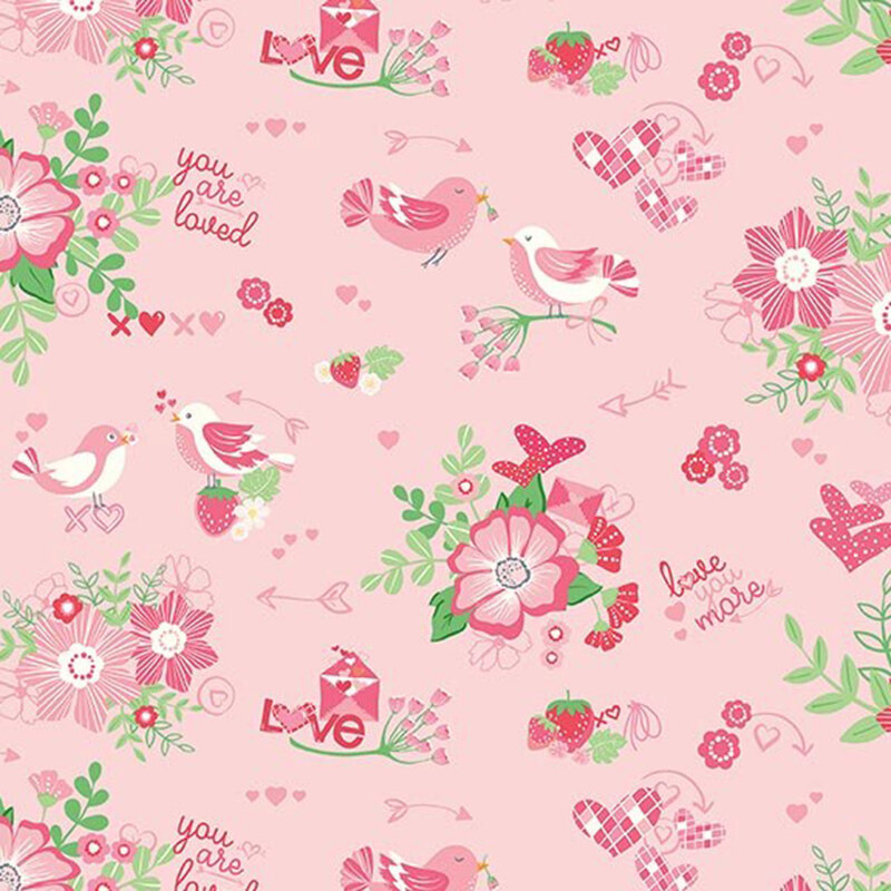 Pink fabric featuring lovebirds, green-leafed florals and other Valentine's day motifs in light pink and magenta.