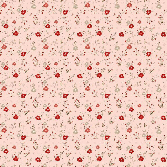 Soft pink fabric with a scattered pattern of florals and sprigs with a dotted background.