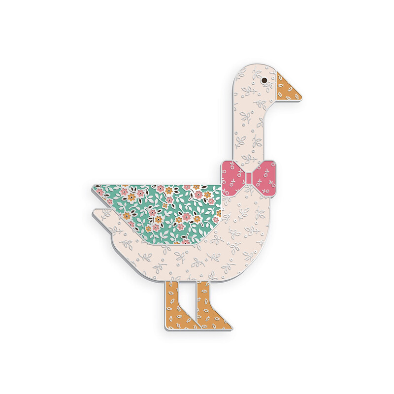 A large needle minder featuring a charming goose with a bow, colored in prints from the Gentler Times collection by Lori Holt for Riley Blake Designs.