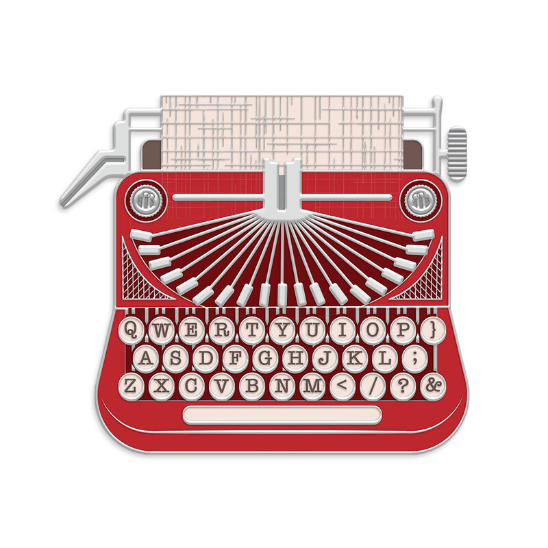 A large needle minder featuring a charming typewriter, colored in prints from the TYPE/ography collection by Lori Holt for Riley Blake Designs.