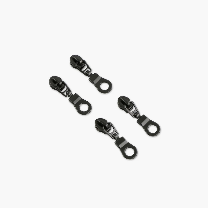 A pack of the Four #3 Donut Zipper Pulls, isolated on a white background.