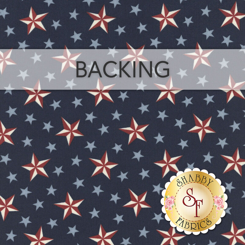A swatch of navy blue fabric with light blue stars scattered with white and red nautical stars. A banner reads "Backing" and a golden Shabby Fabrics logo rests in the bottom right corner. 