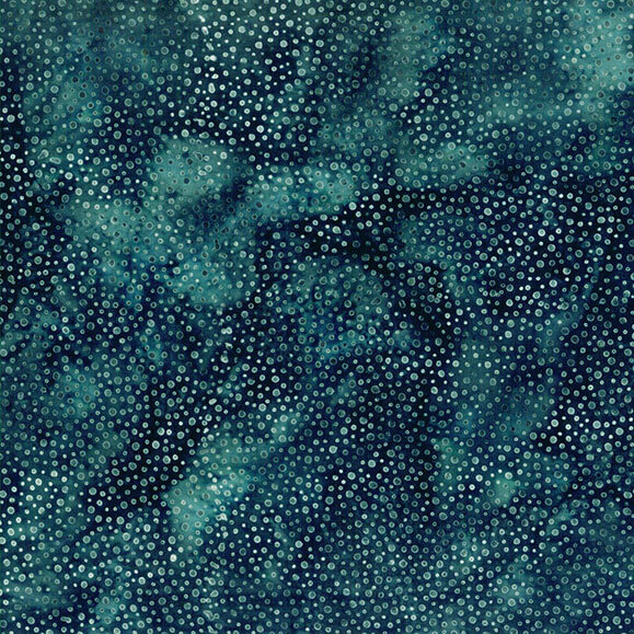 A mottled dark teal and navy blue batik fabric with scattered dots.