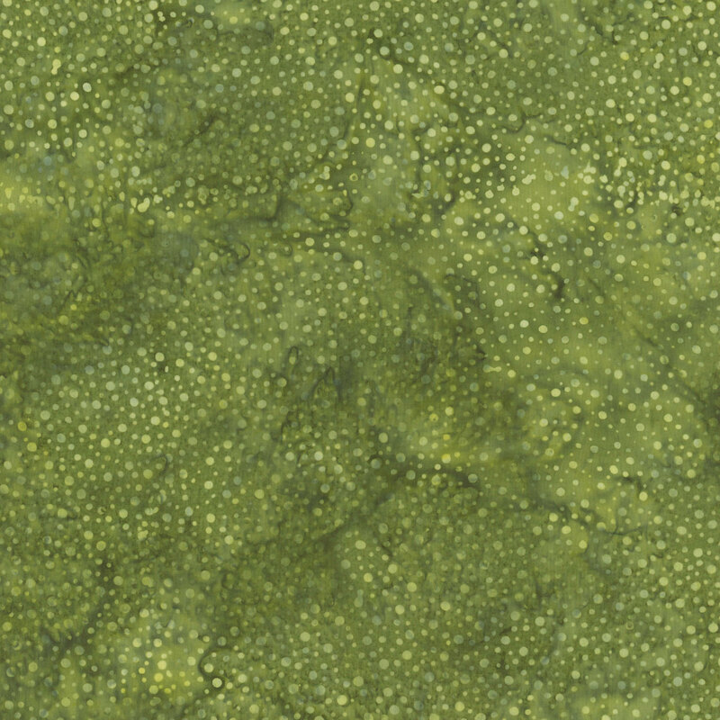 A mottled sage green batik fabric with scattered tonal dots.