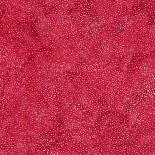 A mottled bright hot pink batik fabric with scattered pink dots.