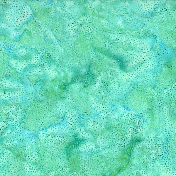 A mottled aquamarine and teal batik fabric with scattered dots.