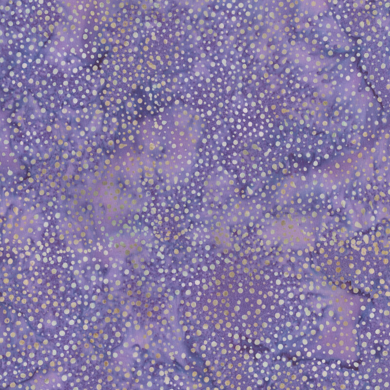 A mottled dark lavender batik fabric with scattered light purple dots.