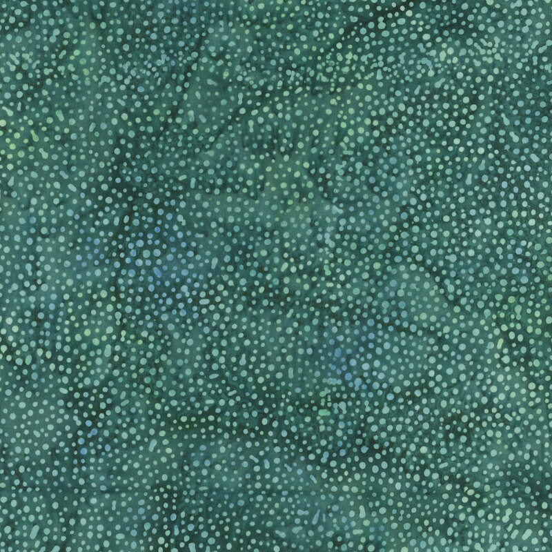 A mottled phthalo green and viridian batik fabric with scattered light green dots.
