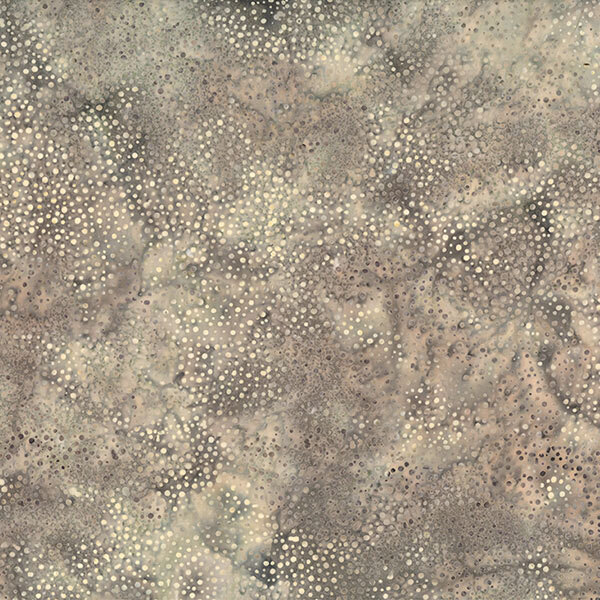 A mottled mouse gray batik fabric with scattered light gray dots.
