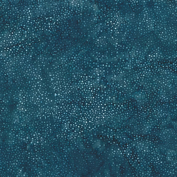 A mottled dark teal blue batik fabric with scattered light teal dots.