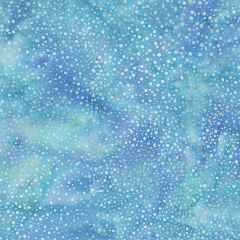 A mottled aquamarine and mermaid blue batik fabric with scattered light blue dots.