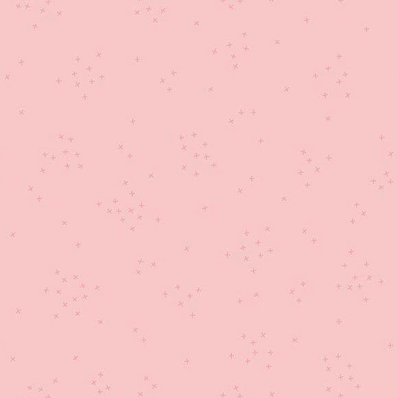 This blush pink fabric is scattered with tiny tonal crosses clustered together.
