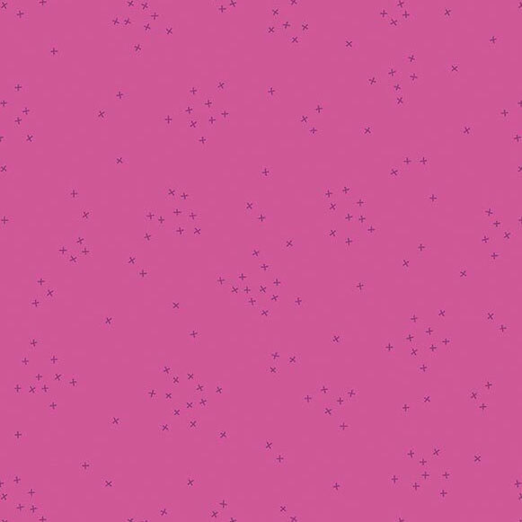 This mauve pink fabric is scattered with tiny tonal crosses clustered together.