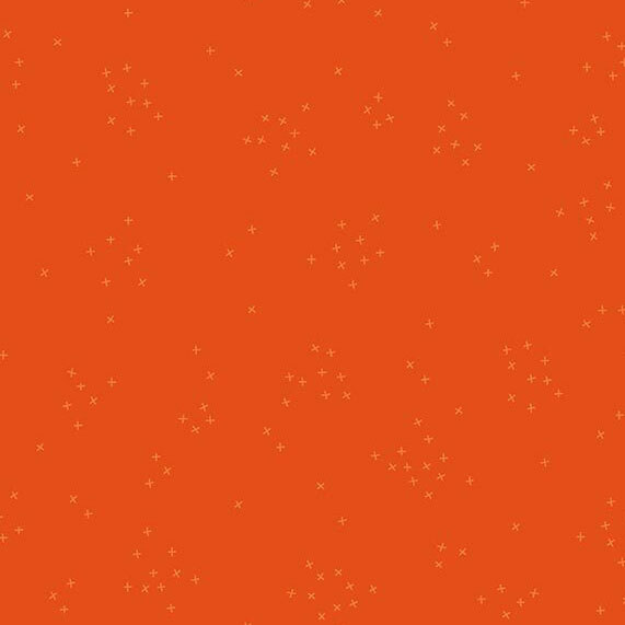 This bright orange fabric is scattered with tiny tonal crosses clustered together.