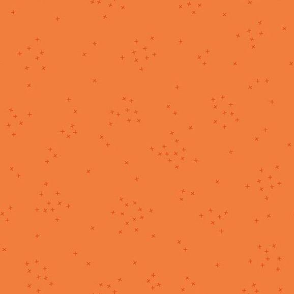 This carrot orange fabric is scattered with tiny tonal crosses clustered together.