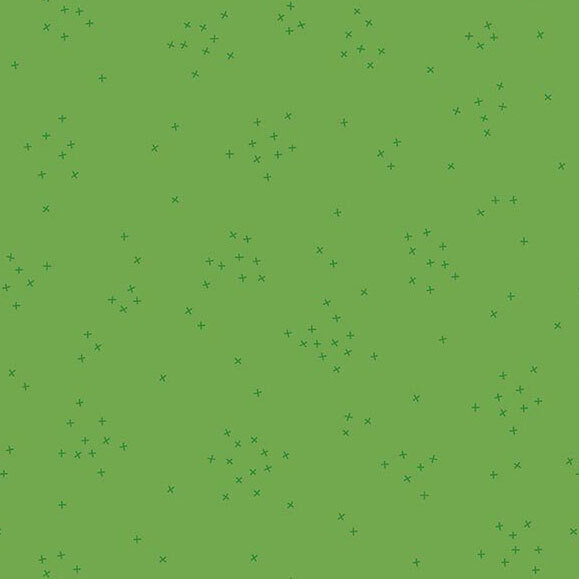 This clover green fabric is scattered with tiny tonal crosses clustered together.