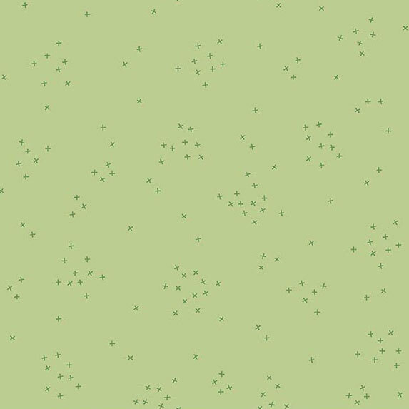 This pistachio green fabric is scattered with tiny tonal crosses clustered together.