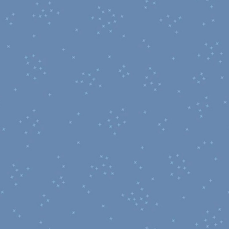 This faded fabric is scattered with tiny crosses clustered together.