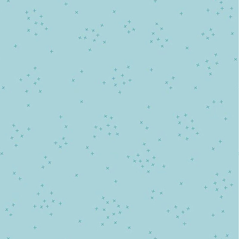This powder blue fabric is scattered with tiny tonal crosses clustered together.