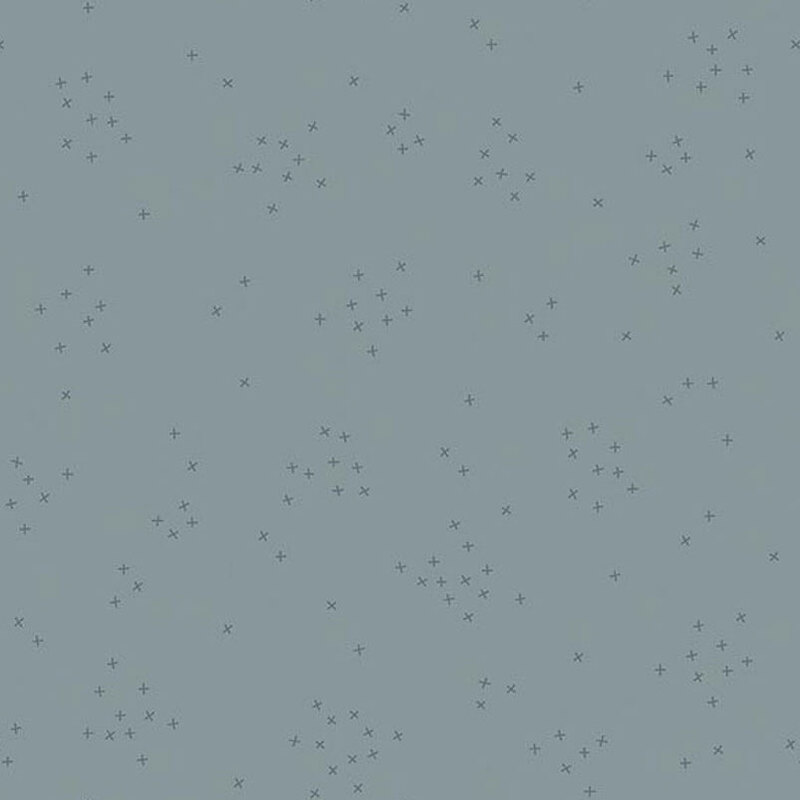 This steel blue fabric is scattered with tiny tonal crosses clustered together.