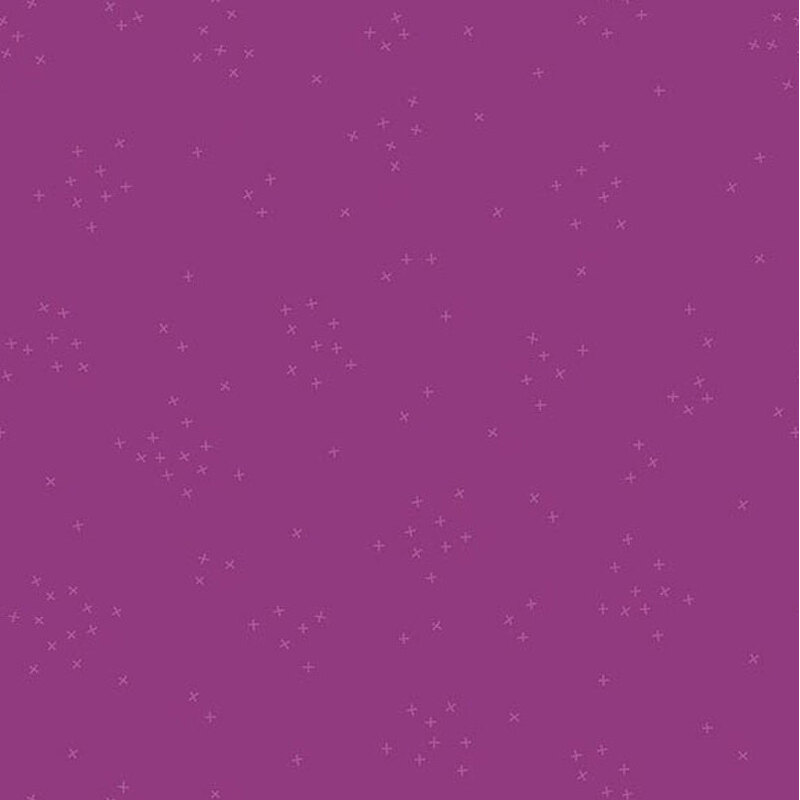 This magenta fabric is scattered with tiny tonal crosses clustered together.